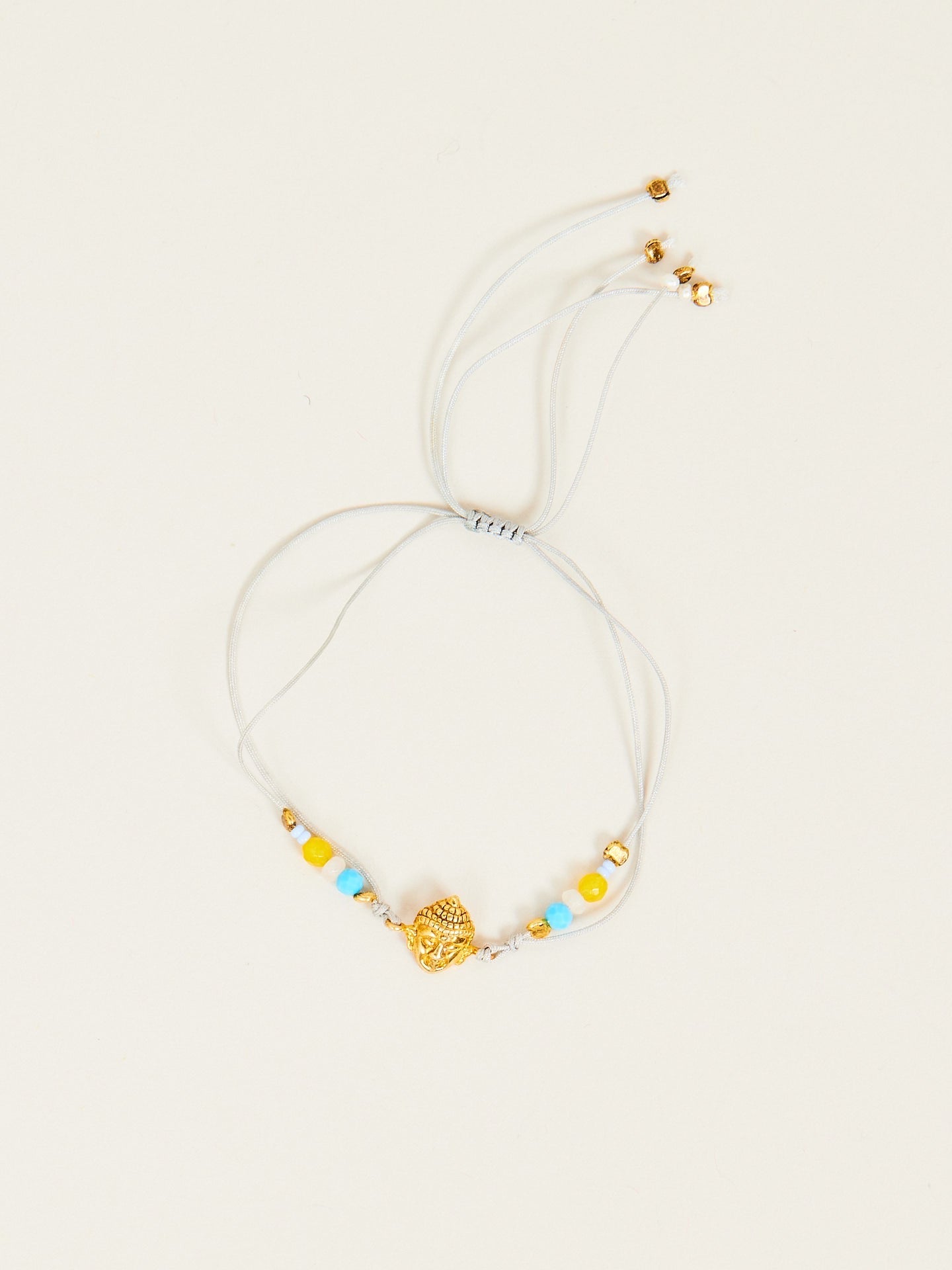 Aufregendes Armband mit goldenem Buddha Anhänger